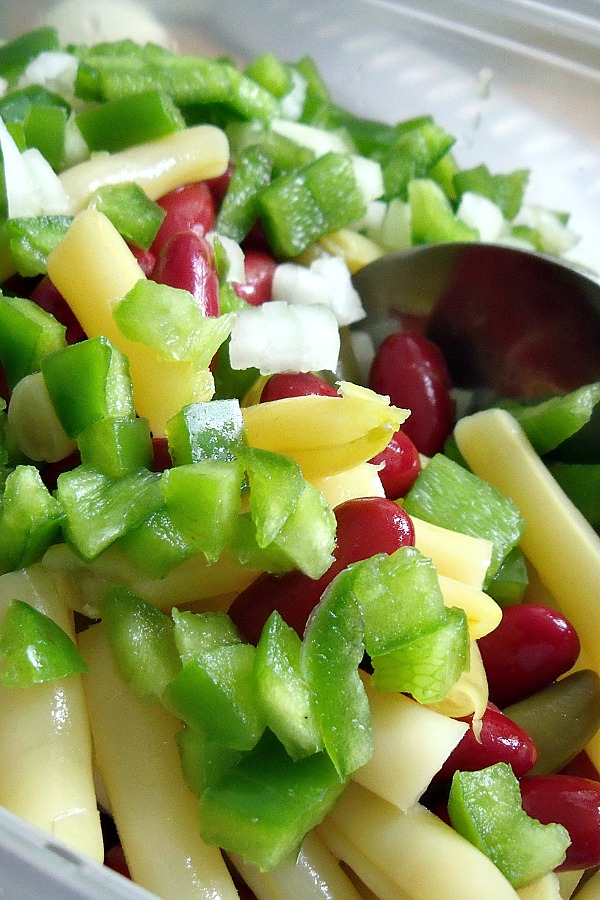 Easy recipe for three bean salad combines green and waxed beans, kidney beans, onion and bell pepper tossed in a sweetened vinaigrette. Great side dish for burgers and hotdogs, barbecued chicken and pork. Serve at your next cookout!