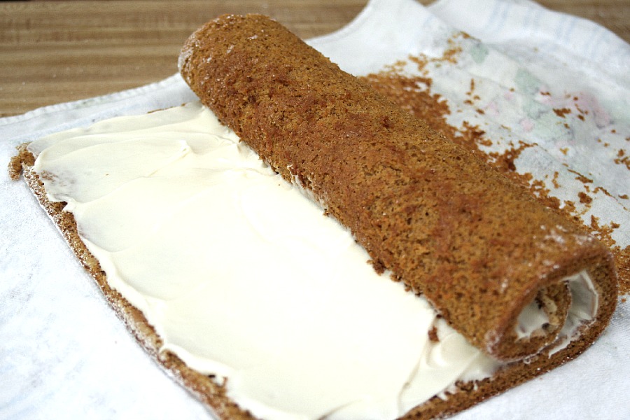 Famous and ever popular Pumpkin Roll. Sweet pumpkin cake with a rich cream cheese filling is a traditional Thanksgiving favorite on the dessert table.