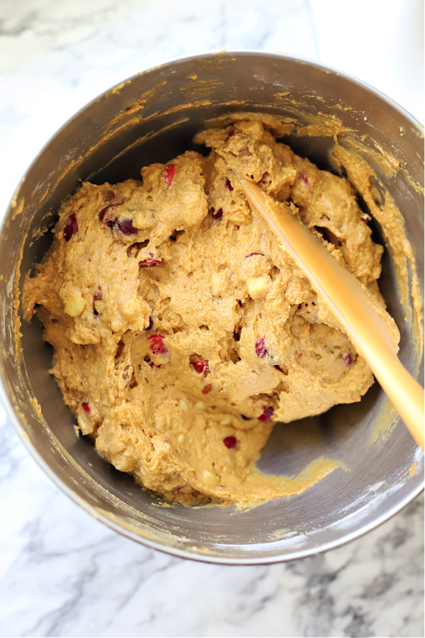 Folding in cranberries into all the flavors of Thanksgiving cake batter