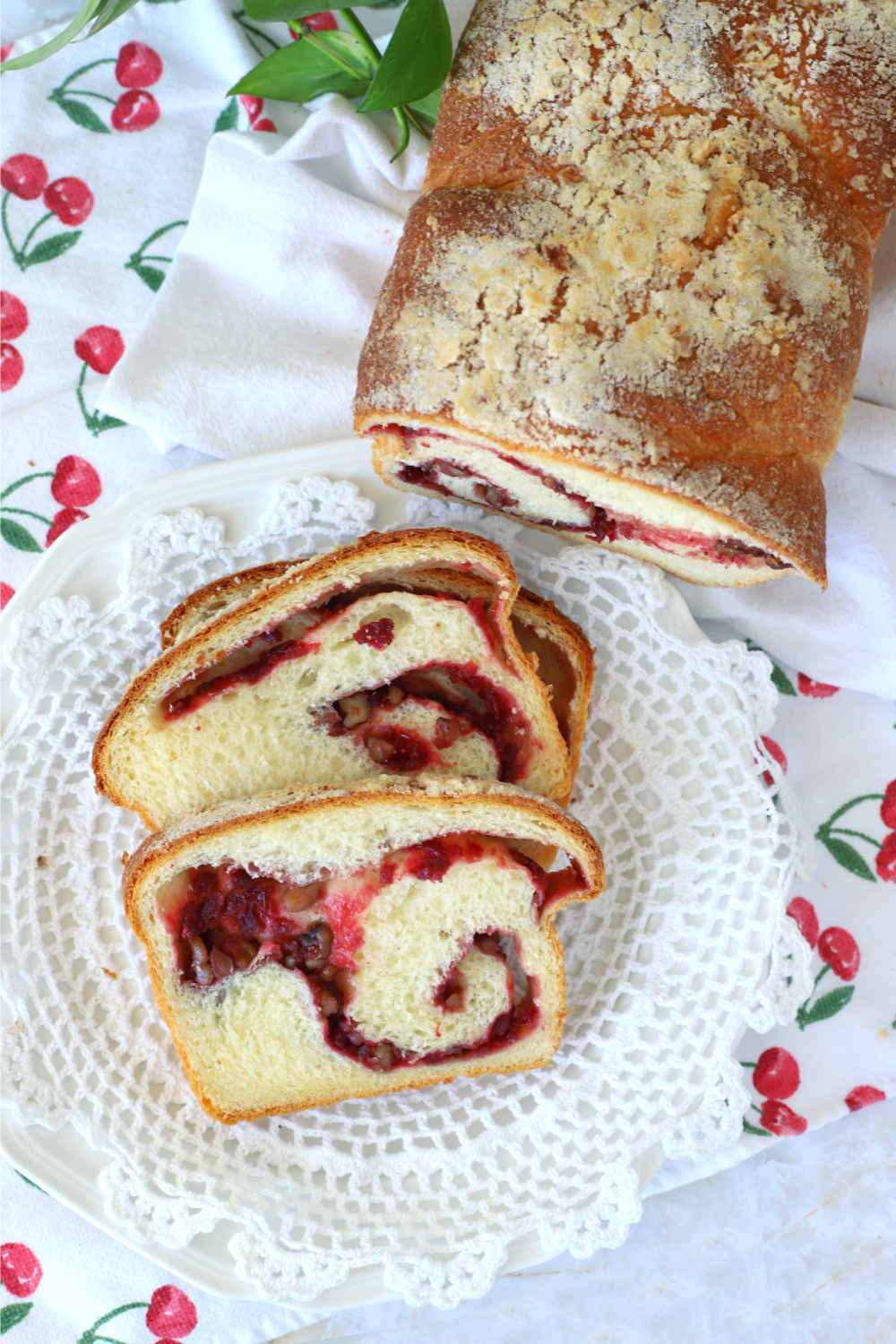 Easy recipe for a loaf of cranberry swirl bread with a pretty filling using fresh or frozen cranberries and walnuts or pecans. Yeast dough made with a bread machine or by hand. 
