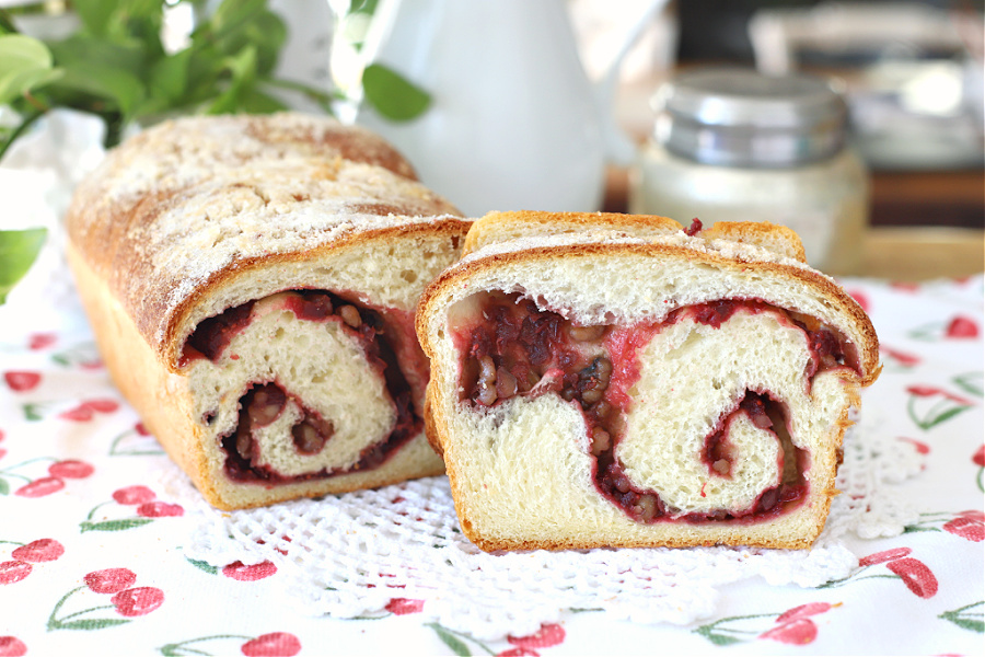 swirls of cranberry and walnut filling in cranberry swirl bread