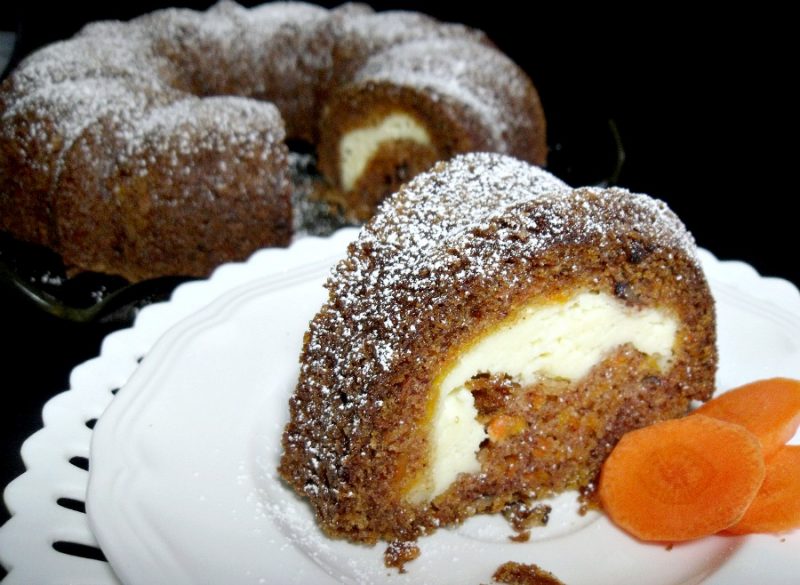 Instead of a rich cream cheese frosting piled on top, surprise carrot cake has a tunnel of sweetened cream cheese in the center. Moist and delicious!