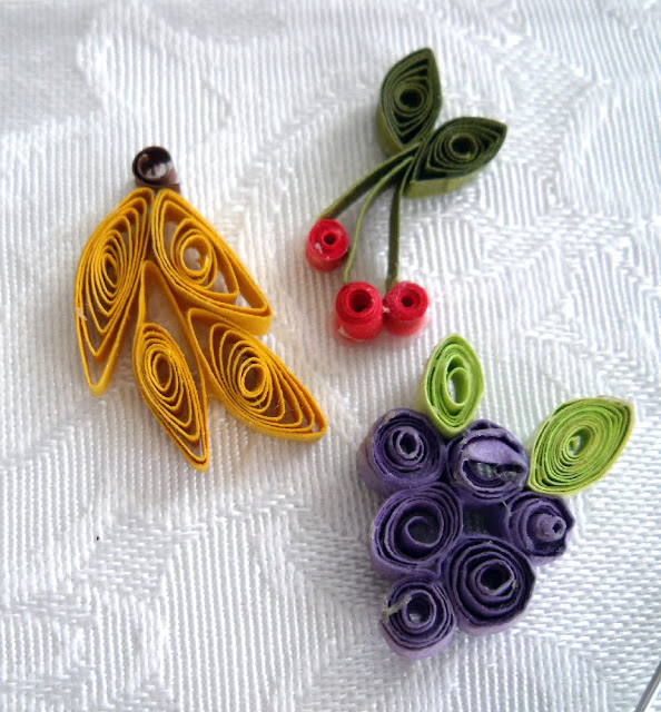 Paper quilling is a craft using thin strips of paper. Create flowers, tendrils and sweet little hearts to decorate and embellish all kinds of projects like this heart pendant.