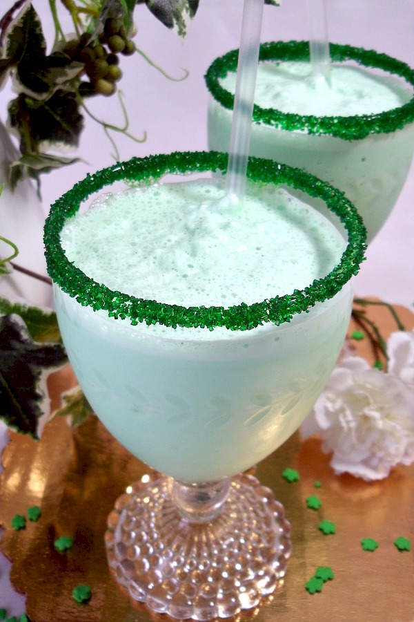 Frosty and minty, Shamrock Milkshake is similar to its fast-food version available each March for St Patrick's Day. Easy recipe to make you own using ice cream, milk, cream and mint for a delightful beverage treat. 