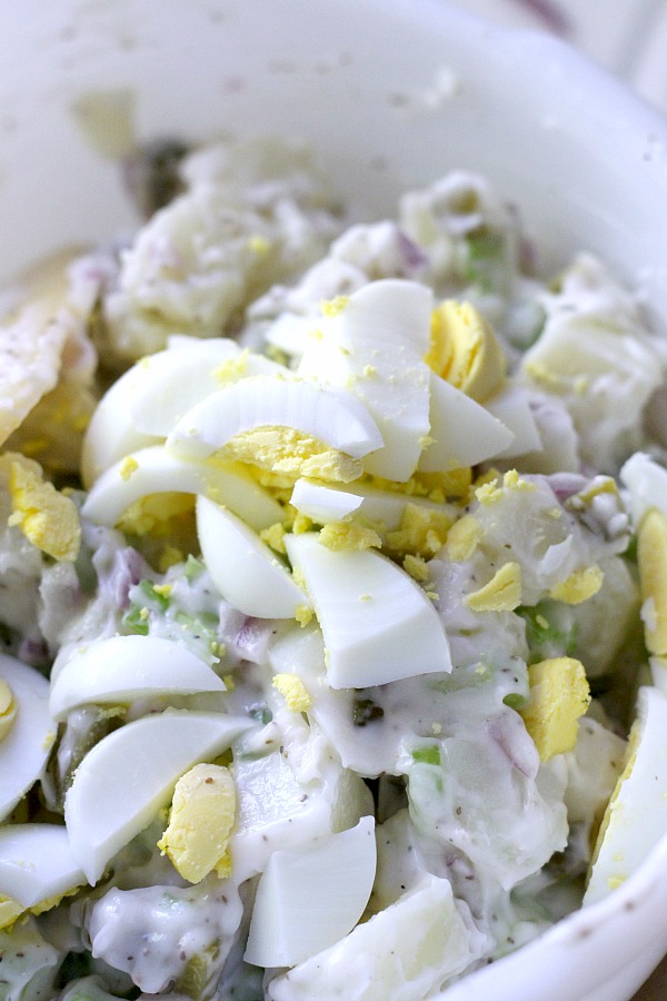 Vintage recipe for old-fashioned creamy potato salad is far from boring. Tons of flavor from sweet gherkin pickles, celery, onions & eggs. A classic barbecue favorite!