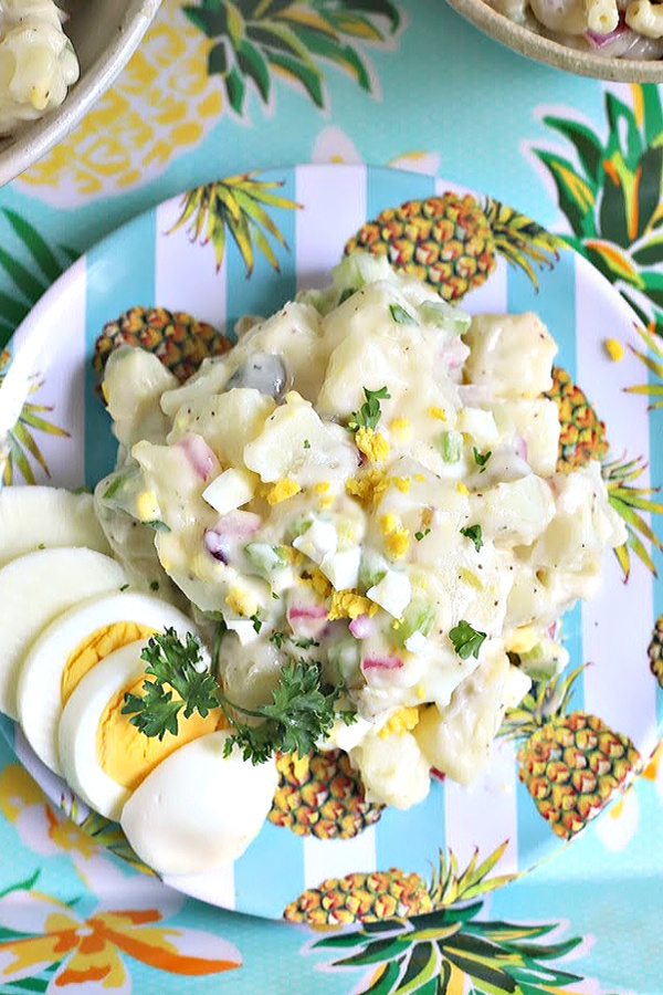 Easy recipe for traditional potato salad that is full of flavor from sweet gherkin pickles, celery, onions & eggs. It's a classic 4th of July cookout favorite side dish with burgers, BBQ chicken and hotdogs! Yummy with baked beans too.