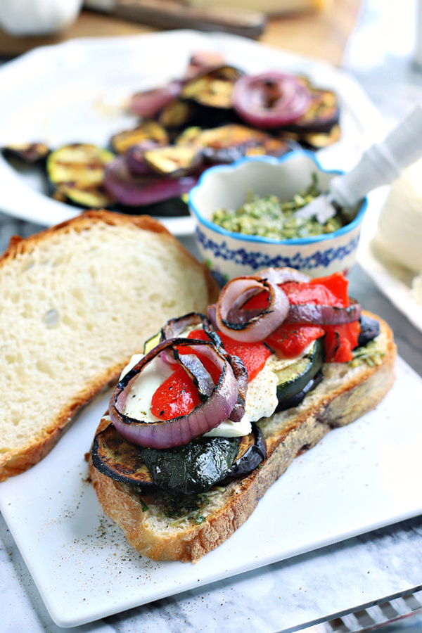 making a grilled eggplant zucchini vegetable panini sandwich