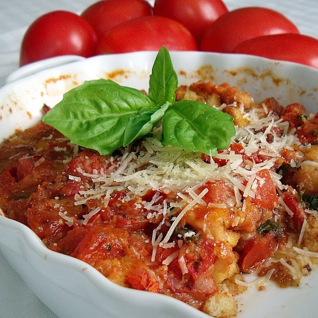 Old- fashioned Scalloped Tomatoes are a perfect, garden fresh, appetizer or side dish made with plum tomatoes, basil, garlic and French bread cubes.