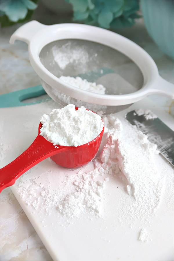 Sifting confectioners sugar for lavender shortbread cookies or French Sables batter.