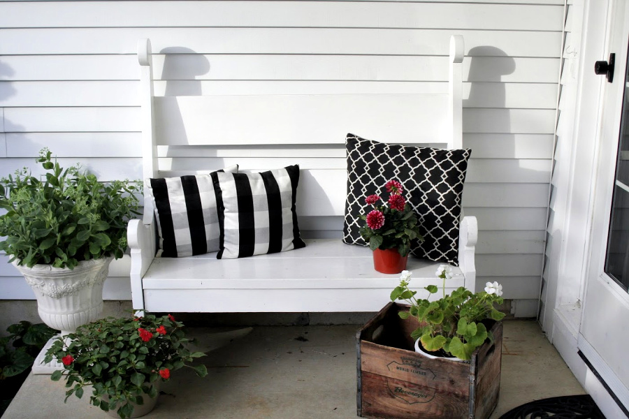 Handmade wooden bench from a vintage Southern Living pattern has found a home in the kitchen, on the front porch and on the patio.