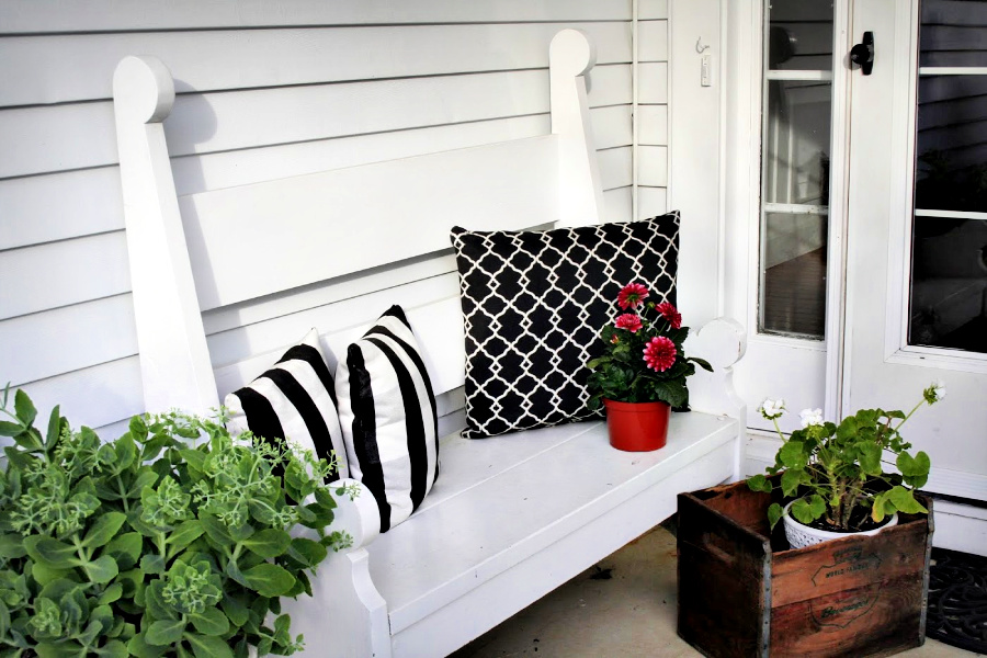 Handmade wooden bench from a vintage Southern Living pattern has found a home in the kitchen, on the front porch and on the patio.