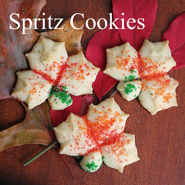Colorful, buttery and tender Spritz cookies made easy with a cookie press. Leaf shape lovely for autumn and Thanksgiving dessert table.