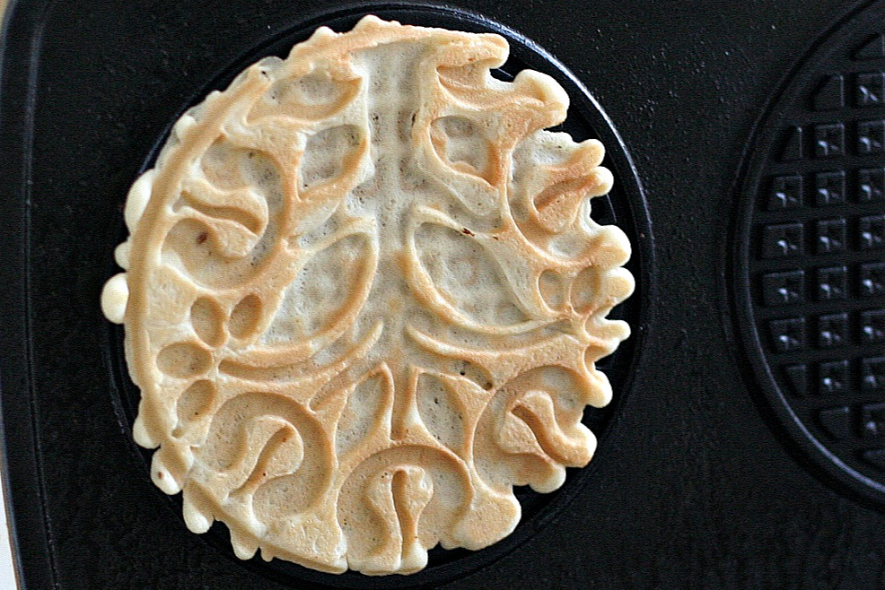 Easy recipe for crisp Italian pizzelles with anise seed made with a pizzelle maker. Perfect for your Christmas cookie tray or dessert table.