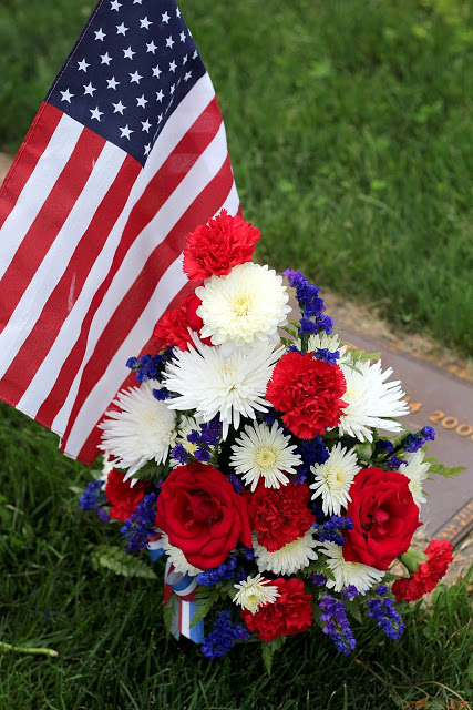 Remembering Memorial day and those who served including World War 1 and World War 2 with American flags decorating each grave at Brigadier General William C. Doyle Veterans Memorial Cemetery.