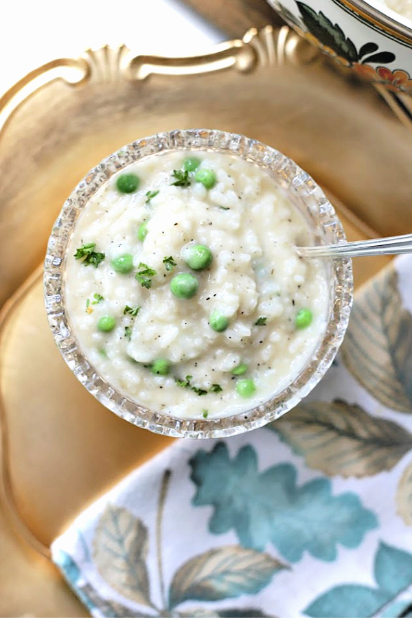 Baked Parmesan risotto is an easier recipe for traditional stove-top simmered risotto. When al dente, additional stock, Parmesan, butter, wine & peas are stirred in creating a creamy rice dish.