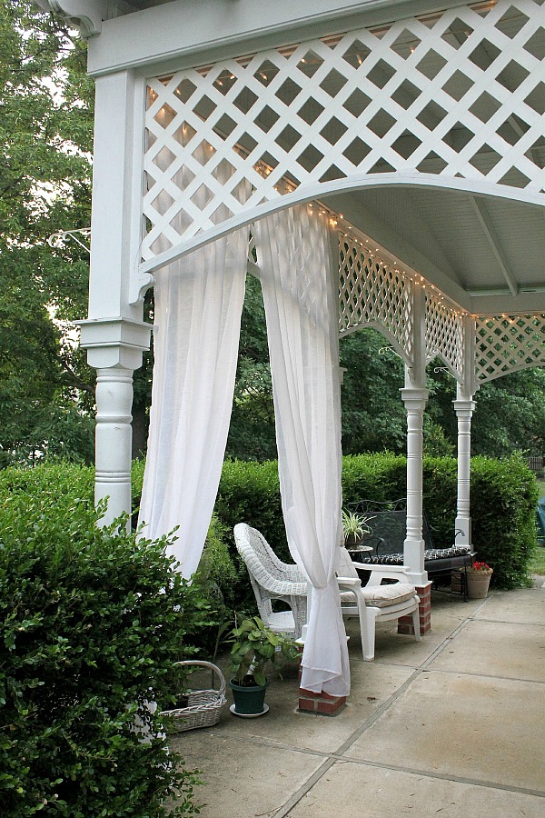 Create an inviting ambiance for dining and entertaining with an easy up-cycling DIY. Re-purposed Curtains for the Patio look lovely and romantic.