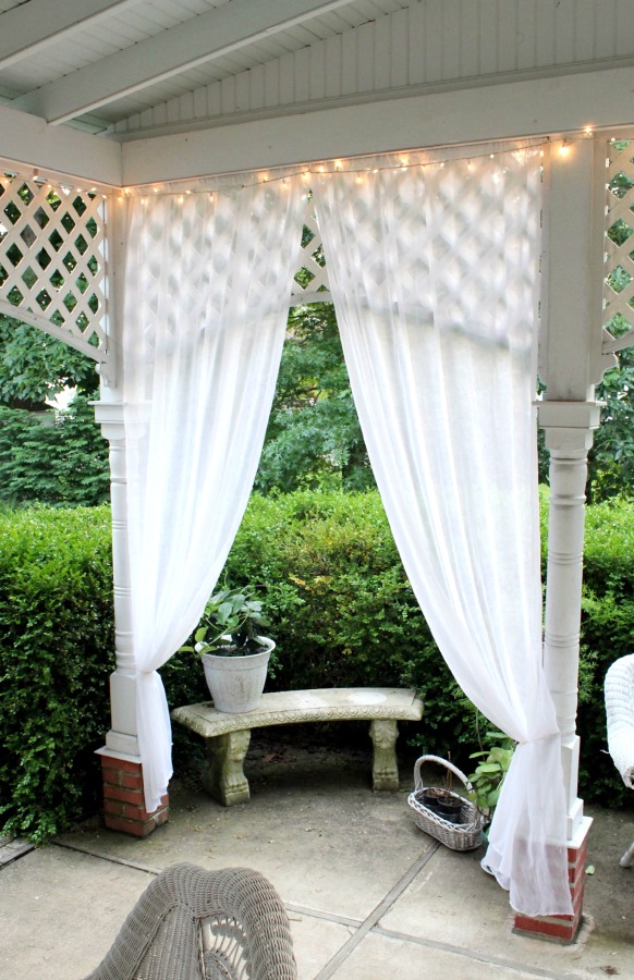 Create an inviting ambiance for dining and entertaining with an easy up-cycling DIY. Re-purposed Curtains for the Patio look lovely and romantic.
