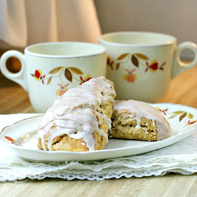 Easy recipe for spice glazed pumpkin scones with cinnamon, nutmeg, cloves and ginger. Delicious autumn breakfast or snack treat.