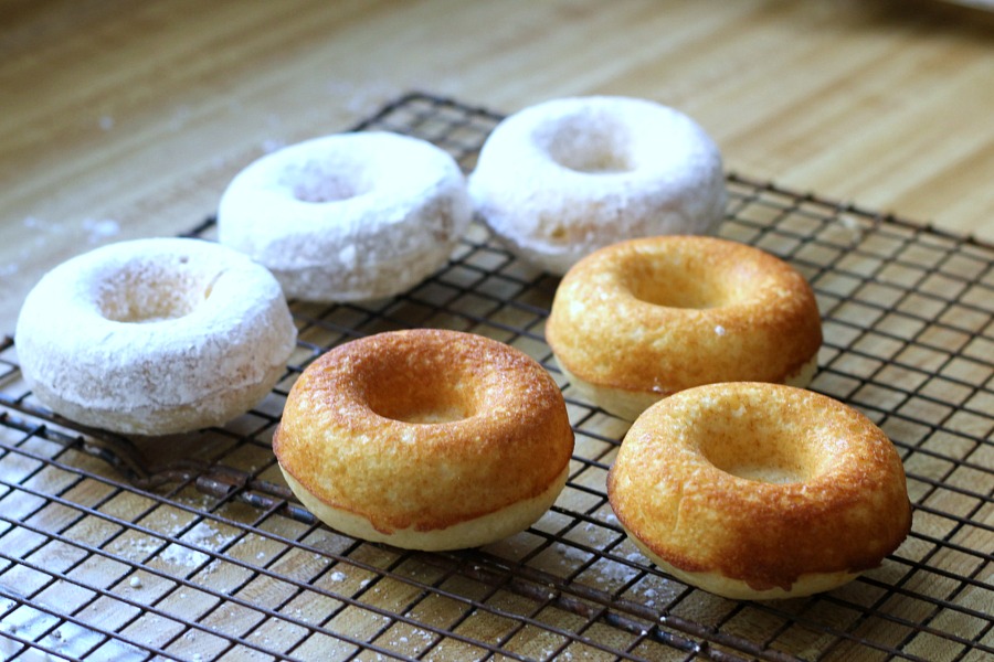 Debate remains as to how to spell these circular wonders of dough with the hole in the center. Spell "donut" or "doughnut", there is no debate about enjoying homemade, baked donuts. The only decision is whether to choose frosted, rolled in cinnamon sugar, confectioners' sugar or a perfectly plain doughnut. Skip the frying with this easy baked version.