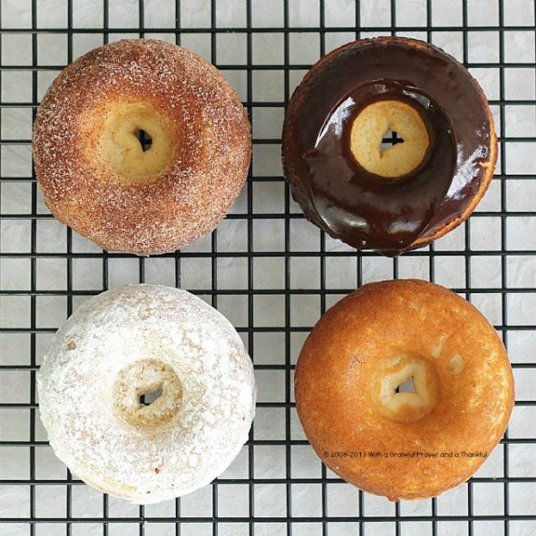 Debate remains as to how to spell these circular wonders of dough. Spell "donut" or "doughnut", there is no debate about enjoying homemade, donuts. The only decision is whether to choose frosted, rolled in cinnamon sugar, confectioners' sugar or a perfectly plain doughnut. Skip the frying with this easy baked version.