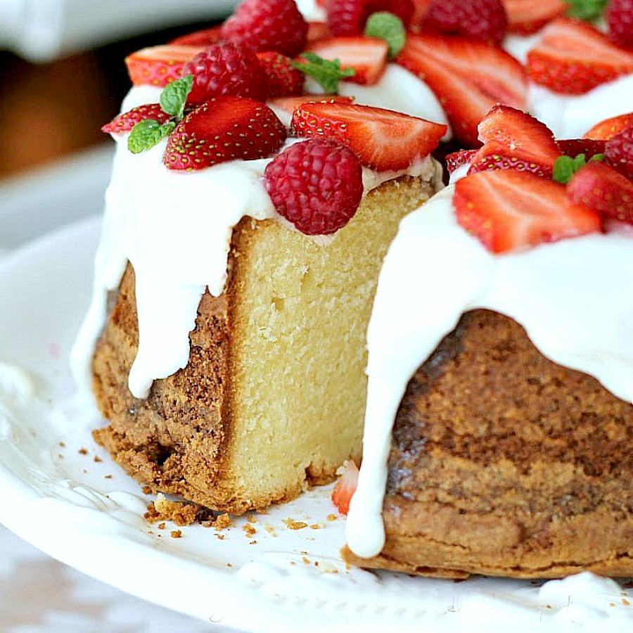 Cream Cheese Pound Cake is a showstopper dessert that is moist and delicious. Serve plain or dress it up with snowy white frosting and top with strawberries.