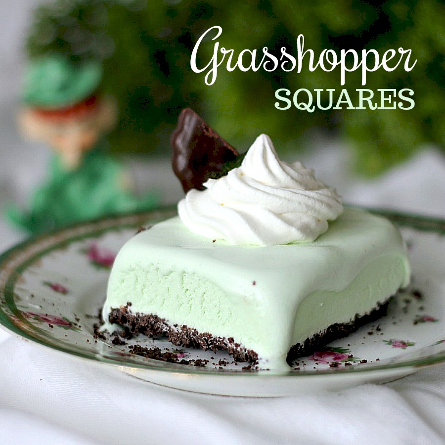 Frozen, minty Grasshopper Dessert Squares are the perfect St Patrick's day treat or any time you want an easy, no-bake dessert. Crust is made using fudge mint cookies and then filed with ice cream and topped with a dollop of whipped cream. Make ahead and freeze and it is ready whenever you want.