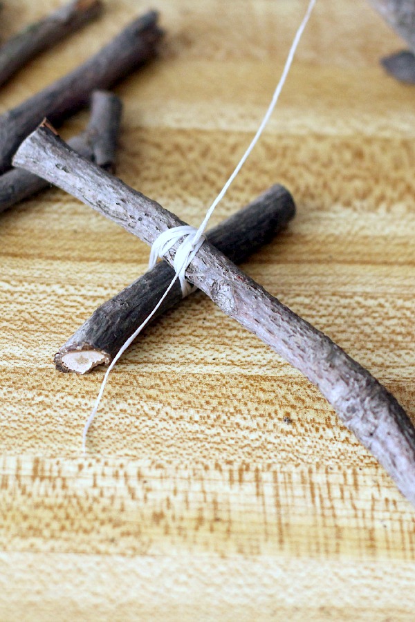 Make a humble little wooden cross from sticks gathered from your yard. Attach a tag with the bible verse from Luke 2:11, "a Savior has been born to you", as you celebrate Easter or Christmas. These little stick crosses are a sweet and easy holiday craft to make for or with kids.