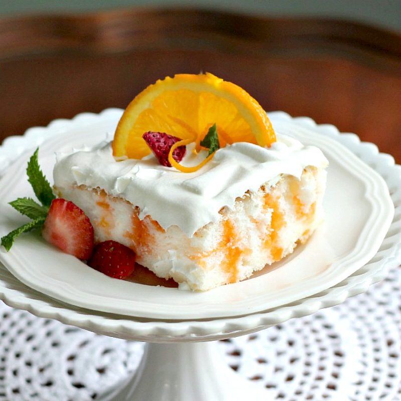 Easy recipe for Orange Angel Cake begins with a box mix. Poke holes throughout the baked cake and pour gelatin mixture over; cool and spread with whipped topping. Delicious!