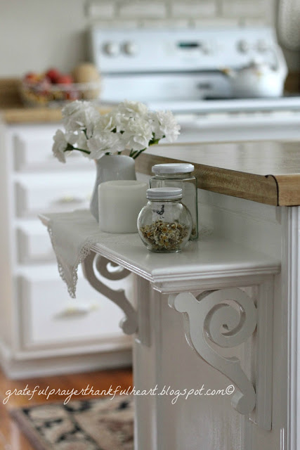 An easy DIY kitchen shelf adds a decorative and functional element to cabinets and counter top giving extra space for serving.