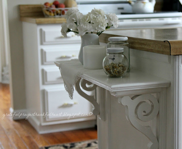 An easy DIY kitchen shelf adds a decorative and functional element to cabinets and counter top giving extra space for serving.