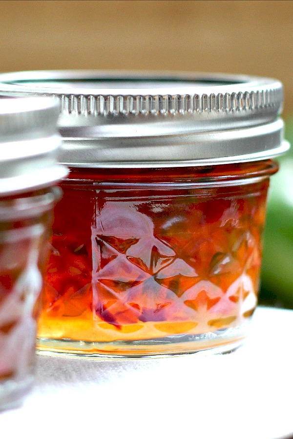 Homemade pepper jam is an easy recipe for a lovely colored, condiment or food gift. Perfect balance of sweet and heat used as an appetizer with cheese and crackers.