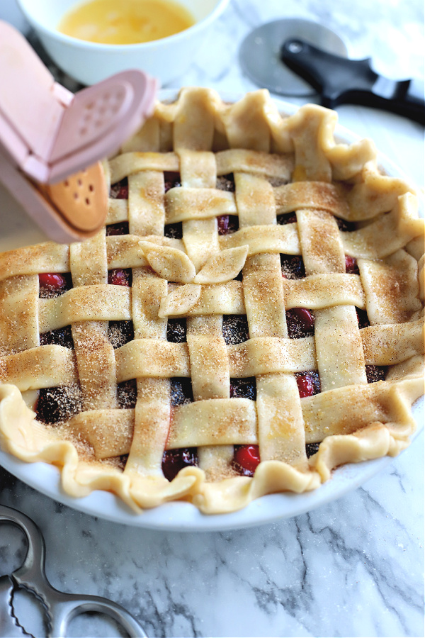 cinnamon sugar on cranberry and fig pie lattice crust
