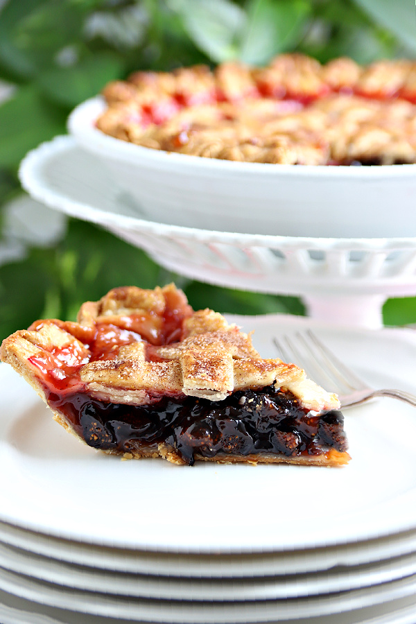 A slice of cranberry and fig pie with the perfect balance of sweet and tart flavors. Easy recipe for this old-fashioned dessert with how-to instructions for making the pretty lattice top crust.