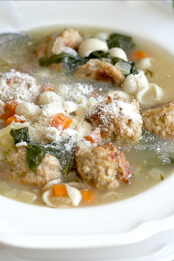 Tender meatballs made with ground chicken and sausage with pasta and vegetables in this easy recipe for classic Italian Wedding Soup. A delicious soup!
