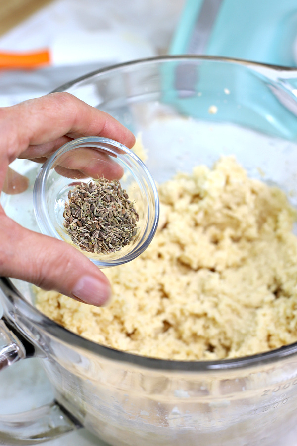 Adding the anise seed to the batter for chocolate anise biscotti