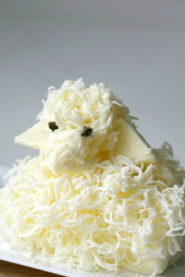 Easy directions to create this sweet little Easter butter lamb, covered in woolly curls. These sweet butter sculptures traditionally accompany the Easter meal for many Russian, Slovenian and Polish families. Butter is shaped into a lamb and is cute, decorative and symbolic for your holiday table.