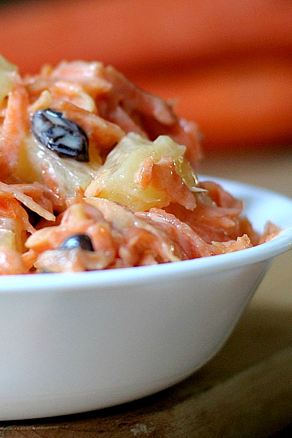 Healthy recipe for crunchy carrot salad and it couldn't be easier to make. No cooking involved. Just a great side dish with the addition of sweet pineapple and raisins. A lovely addition to your Easter dinner menu.