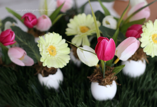Sweet and dainty, springtime Easter flowers in eggshell pots are super cute. Fill with faux flowers, fresh cut flowers or plant seeds and watch them sprout. Tuck into spaces needing some happy after a dreary winterscape.
