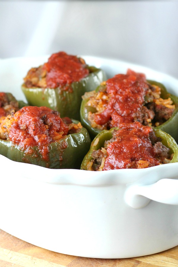 Classic stuffed peppers are an easy and comforting meal of tender bell peppers filled with ground beef and rice, baked and topped with your favorite sauce. 