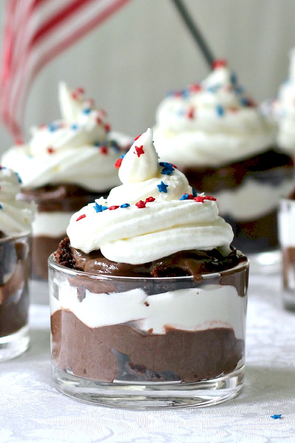 Top an easy brownie truffle parfait with chocolate pudding and whipped cream with little red, white and blue star sprinkles for a patriotic themed dessert. 