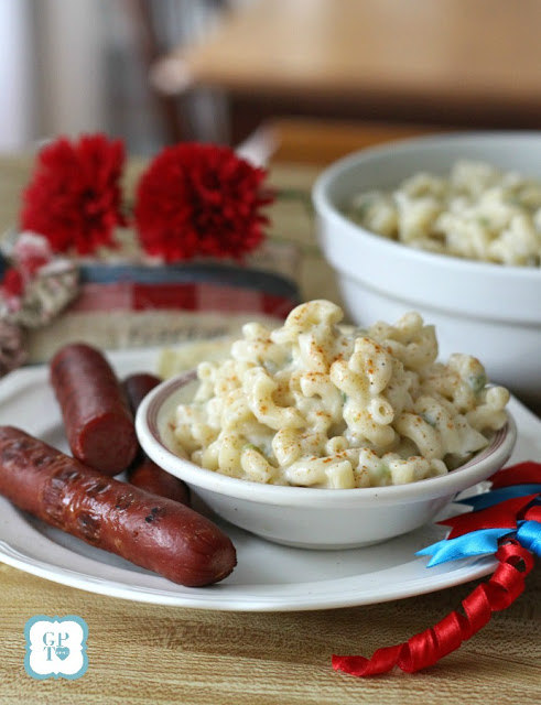 Easy recipe for a classic All-American Macaroni Salad. Perfect side dish for cookouts and barbecues. Serve with hotdogs, burgers, chicken and pork as you celebrate the 4th of July with food and fireworks!