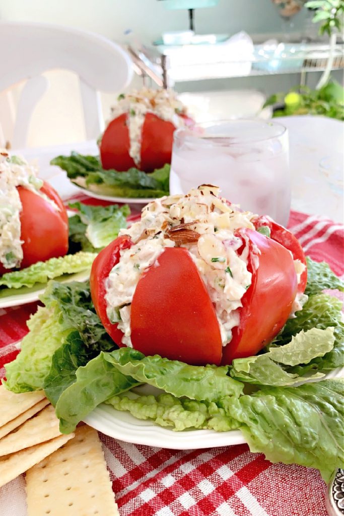 Use fresh garden tomatoes for creamy chicken stuffed tomatoes filled with fresh herbs, pineapple and cream cheese for a light summer lunch.