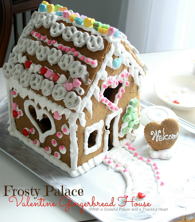 Super sweet, to make, Valentine's Day Gingerbread House. Decorate with Royal Icing as the glue for favorite candy and treats. Great kids project.