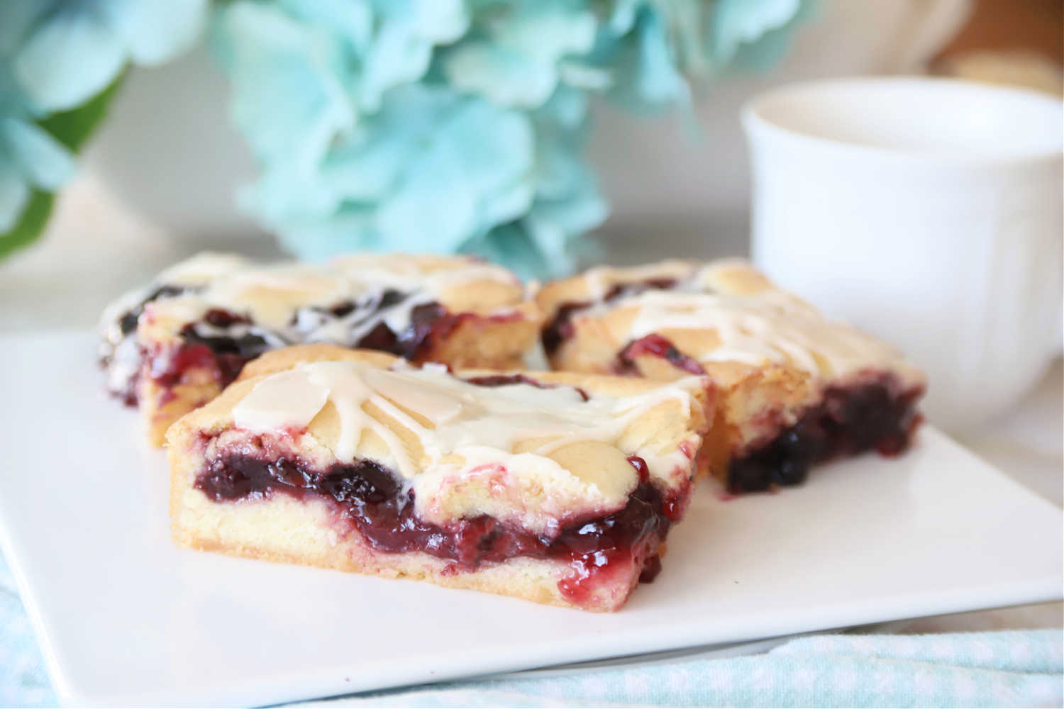 Easy cherry blueberry fruit bars with frosting recipe.