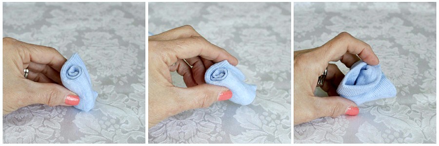 Step-by-step tutorial for making a sweet baby sock bouquet as a shower decoration or as a gift for a new mom.