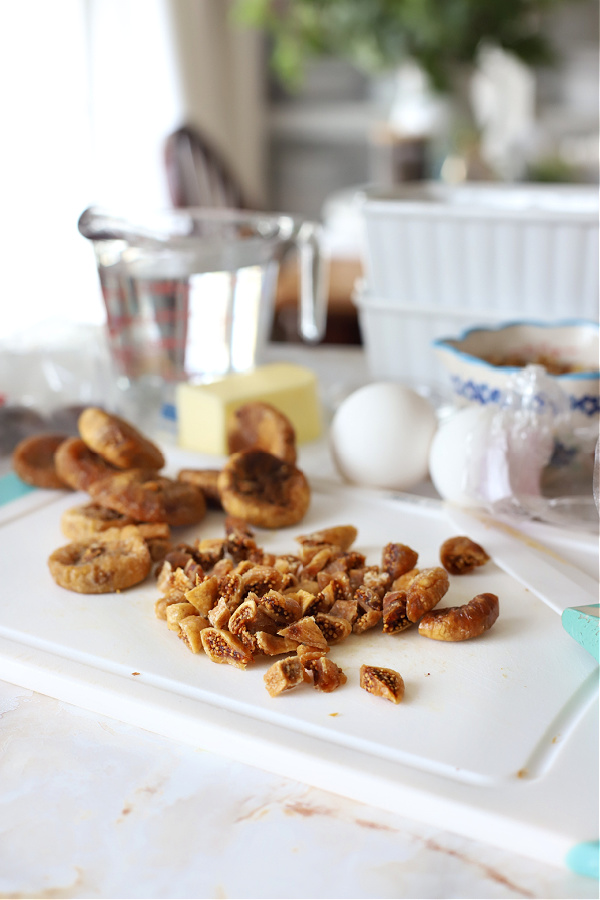 Chopping the dried dates for fig & date quick nut bread recipe.