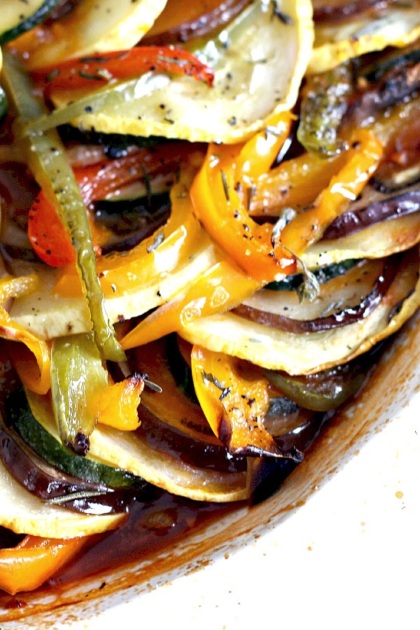 Ratatouille is a healthy combo of summer veggies and kid-friendly. Easy recipe of sliced eggplant, zucchini, bell pepper and fresh herbs arranged over tomato sauce and baked until tender.