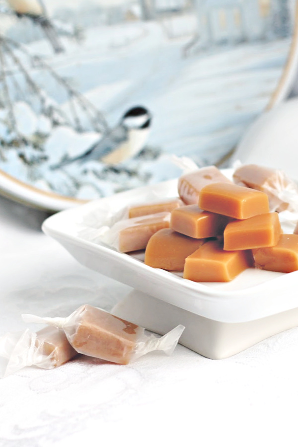 Super easy recipe for delicious caramels using the microwave. Soft candy begins with condensed milk and in just a few minutes it is ready to pour into a dish. Cool, cut and enjoy! Lovely packaged up for holiday gift-giving.