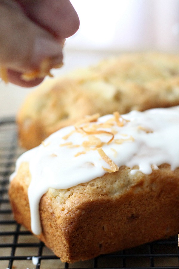 Frosted Pear Quick Bread with Toasted Coconut is a yummy quick bread filled with fresh pears, a hint of ginger and topped with frosting and toasted coconut.