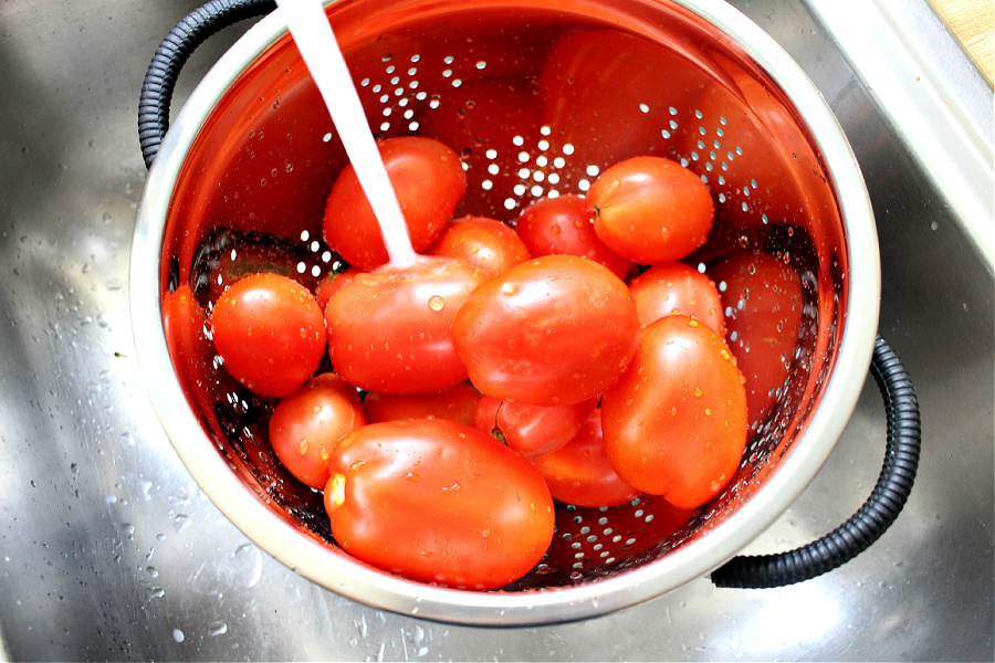 washing Roma tomatoes for roasted tomato Capresse salad